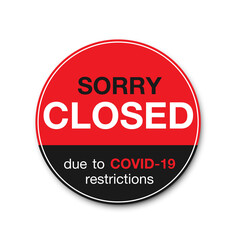 Hanging sign about coronavirus and close-up on a red closed sign of a shop displaying the message 