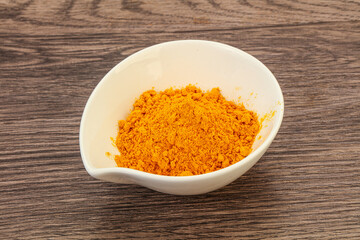 Tumeric powder in the bowl