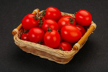 Ripe juicy cherry tomato in the bowl