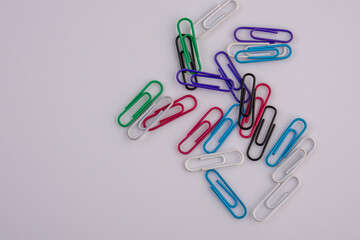 colorful paper clips isolated on white background