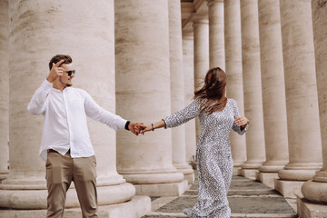 Loving couple at the St. Peter's Square in Vatican