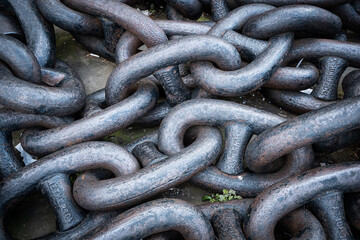 Giant rusty chain in the dock