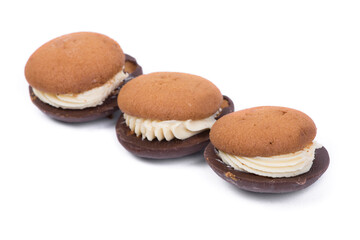 Three pastry biscuit sandwich with chocolate