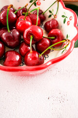 Cherries on a ceramic plate