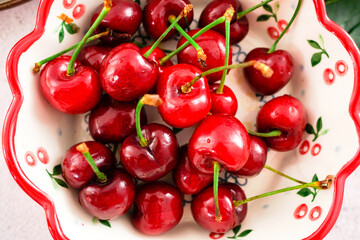 Cherries on a ceramic plate