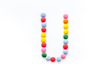Candies font alphabet. Letter U isolated top view