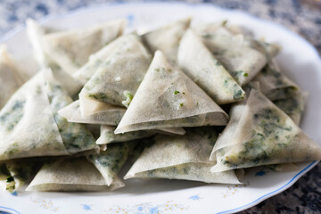 Vertical shot of a healthy breakfast table with a small bowl of delicious Algerian dates and other fruits on the background.
