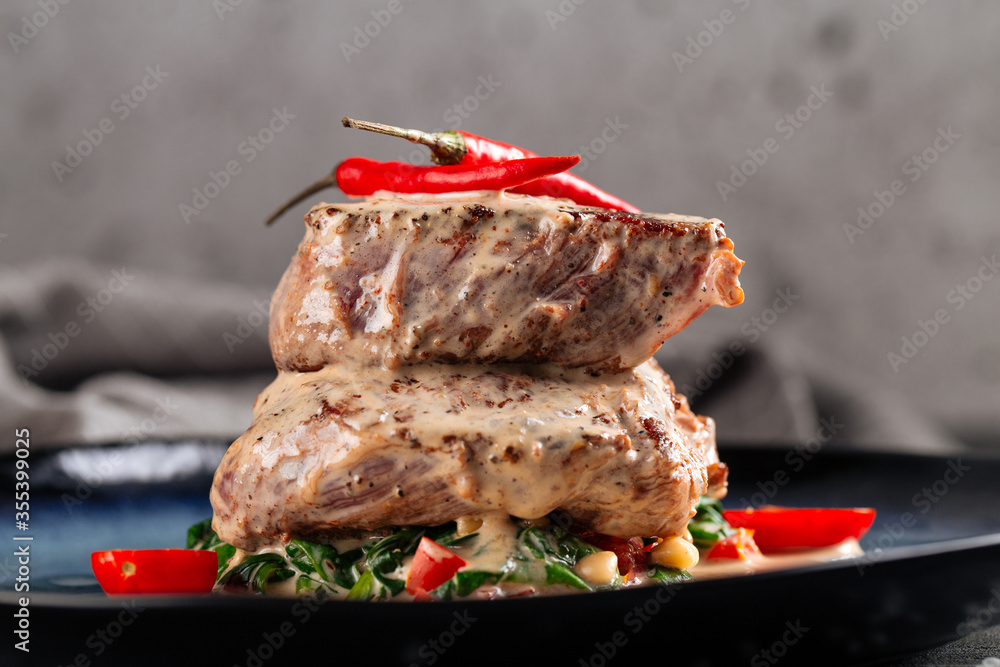 Wall mural appetizing fillet mignon steaks with sauce