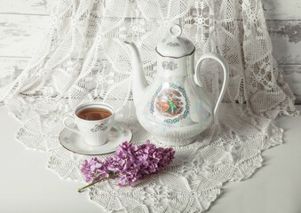 Still life with tea and flowers