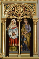 Saints Veronica and Mary Magdalene statues on the main altar in the church of St. Stephen the Protomartyr in Stefanje, Croatia