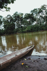 old aboriginal boat on a river in the amazon