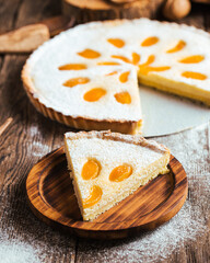 Cut piece of sweet delicious apricot curd cake pie