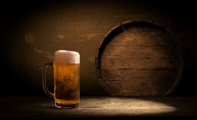 Beer style- bottle, beer in the glass and covers on wooden table. Free space for text. Top view