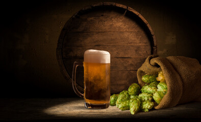 Beer style- bottle, beer in the glass and covers on wooden table. Free space for text. Top view