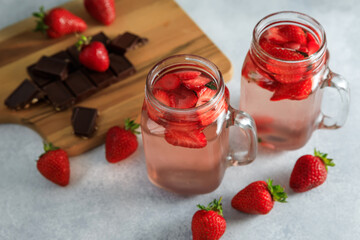 Strawberry drink with berriesand wooden board with chocolate. Diet drink, healthy concept