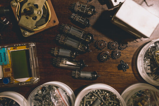 Electronic vacuum tubes and other electronic components on the table.