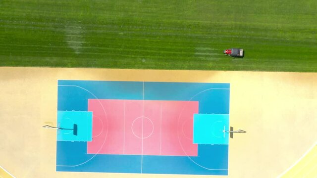 Basketball court on stadium from above. Aerial view to playground.