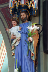 Obraz premium Saint Joseph holds the baby Jesus statue in the parish church of the Nativity of the Virgin Mary in Granesina, Croatia