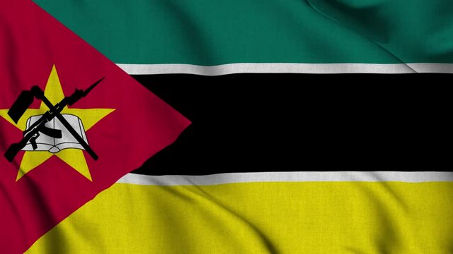 Mozambique national flag waving with fabric texture fluttering in wind in a seamless loop in smooth slowmotion animation background
