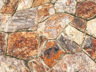 Fototapeta premium Detail of a stone wall with different for background