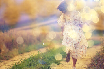 happy girl freedom in summer field, glare of the sun abstract background france provence autumn