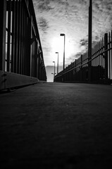 Black and white photo of a walk way