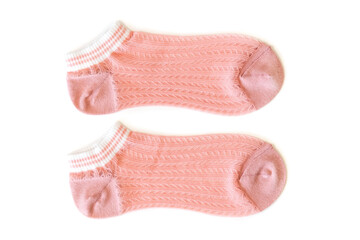 Pink pair of women's thin socks on a white isolated background.