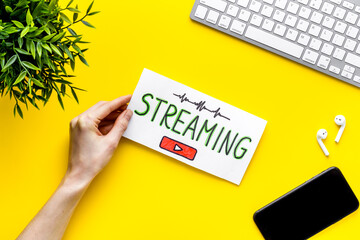 Streaming video concept - tablet on office workplace. Top view