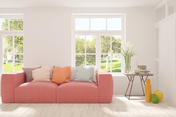 White stylish minimalist room with coral sofa and summer landscape in window. Scandinavian interior design. 3D illustration