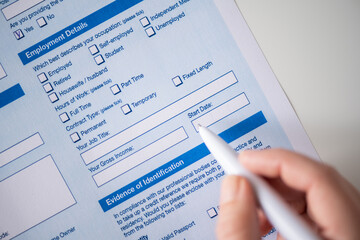 Woman filling employment contract, tick start data of work in count employment detail. Close up....