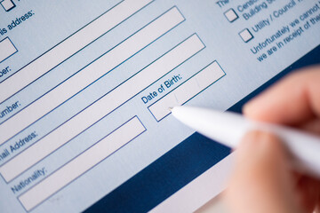 Woman customer filling property reservation form, date of birth, personal information,email,...