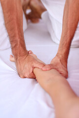 Fototapeta na wymiar Vertical view of Shiatsu massage supine position massaging forearm.