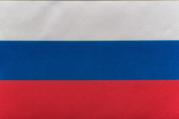 National emblem of Russian Federation. Flag of Russia on close up. Tricolor flag of white blue red.