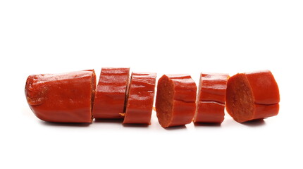 Thin sausage chopped up into round slices for grilling isolated on white background