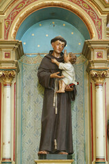 St. Anthony holds the baby Jesus, statue on the altar of St. Anthony of Padua in the parish church...