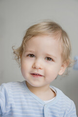 Happy sweet little baby boy portrait on white background