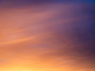 Beautiful sunset gradient from magenta sky to peachy clouds. Sunrise sky perfect for background and backdrop design