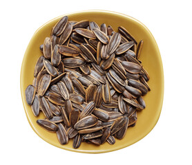 Unpeeled sunflower seeds in bowl isolated on white background. Top view