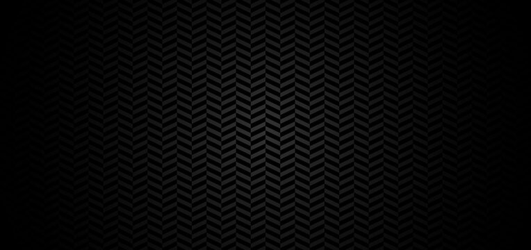 Abstract chevron pattern on black background with lighting