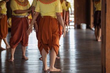 Closeup the feet of Thai old women is dancing beautifully at the tourist attractions in...