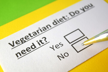 Fototapeta premium One person is answering question about vegetarian diet.