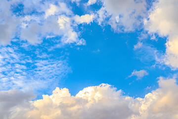 Summer bright blue sky with clouds outdoor background