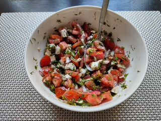 vegetable salad in a white bowl
