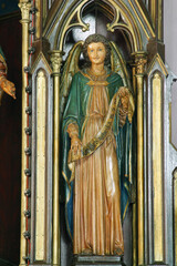 Fototapeta premium Angel statue on the altar Mary Queen of the Holy Rosary at Holy Trinity Church in Krapinske Toplice, Croatia