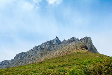 views from the base of the famous table mountain in cape town, south africa with a blue sky and nice clouds