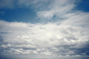 Fototapeta na wymiar Tinted dark blue sky and clouds