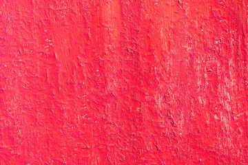 Obraz premium Beautiful vintage red background with old red paint with rough surface, streaks and uneven texture of red paint on old rough surface