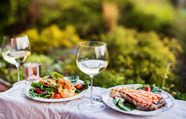 grilled salmon with salad and wine