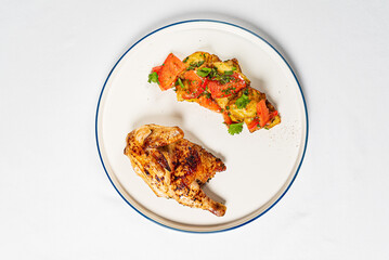 chicken with roasted vegetables on the white