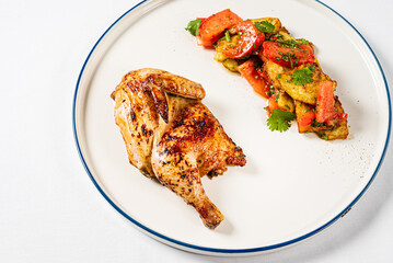 chicken with roasted vegetables on the white